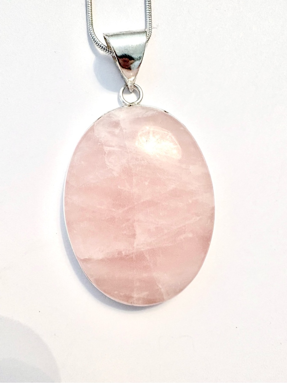 Beautiful, 2 inch,  Rose Quartz pendant on a silver chain.